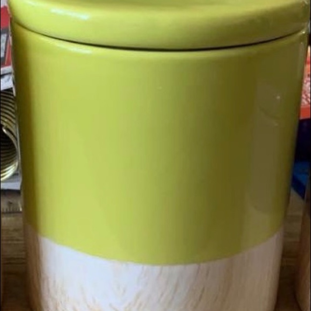 Glass jar with a wood like pattern bottom